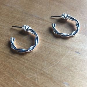 Silver colored metallic braided hoop circular earrings